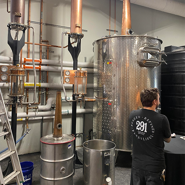 291 Distillery's setup includes two stills and a thump keg, lower left.
