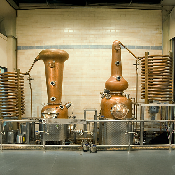 Hirsch The Departure is one of the last whiskeys distilled at Hotaling's original Potrero Hill facility (stills pictured)
