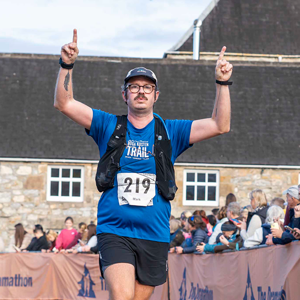 This story's author Mark Jennings crosses the finish line.