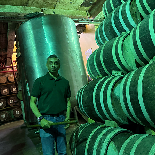 Distiller and blender Michael D'Souza in Paul John's underground warehouse. Photo by Sean Evans
