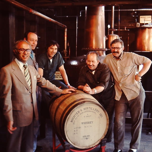 The Schafferstown staff pose with the first barrel filled off of the new stills. CREDIT ELAINE STOLL