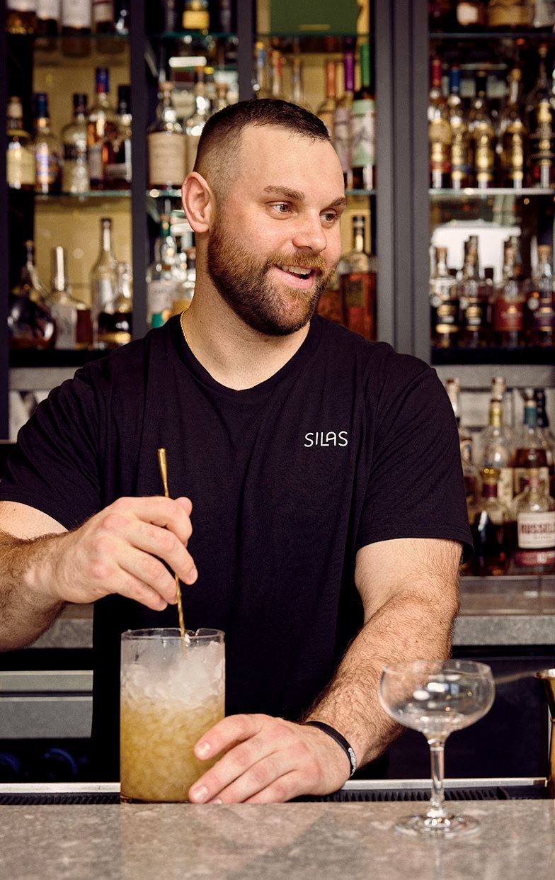 Mixing a Man of the Woods cocktail. AARON CONWAY